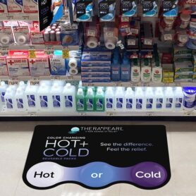 Retail store aisle with a large decal on the floor promoting product